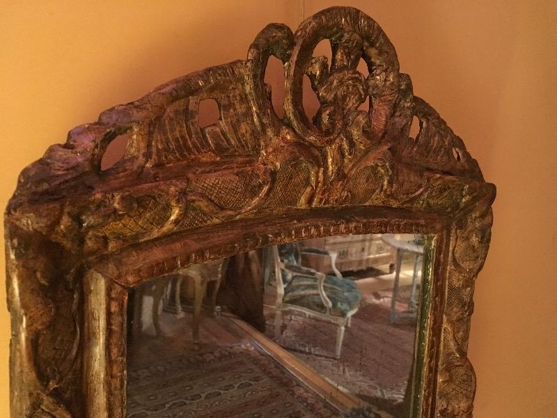 Miroir époque régence encadrement en bois sculpté 